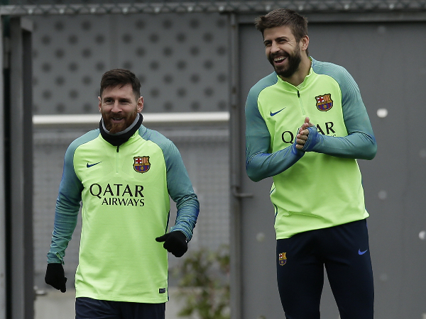 Gerard Pique dan Lionel Messi